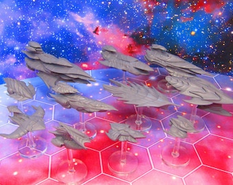 May include: A collection of ten grey spaceship miniatures on clear plastic bases. The spaceships are various sizes and shapes, with some having a more angular design and others having a more rounded design.