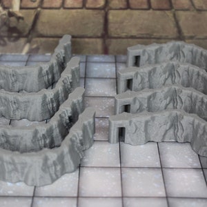 May include: Set of eight gray plastic 3D printed dungeon wall pieces for tabletop gaming. The pieces are designed to be used as walls or barriers in a dungeon setting.