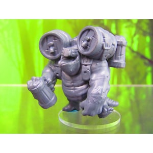 May include: A grey, miniature figurine of a creature carrying barrels on its back and holding a mug in one hand. The creature has a reptilian appearance with a toothy grin. The figurine is set on a clear plastic base.
