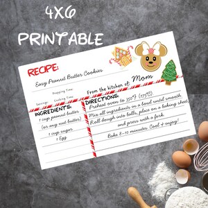 May include: A printable 4x6 recipe card for Easy Peanut Butter Cookies. The card features a recipe with ingredients, directions, and decorative elements like a gingerbread house, a Minnie Mouse cookie, and a Christmas tree. The text includes "PRINTABLE" and "RECIPE".