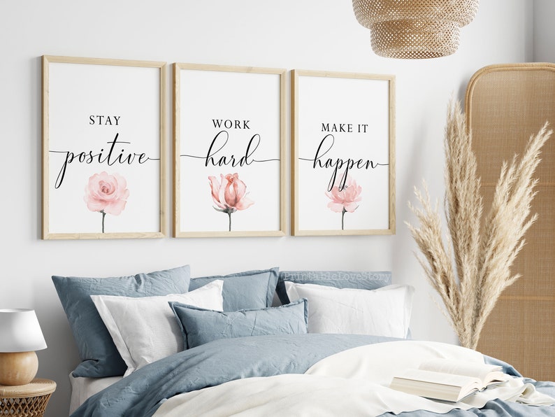 May include: Three framed prints with motivational quotes and watercolor pink flowers. The quotes are "Stay positive", "Work hard", and "Make it happen".