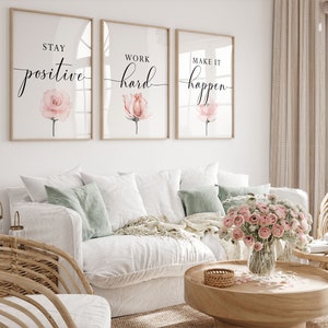 May include: Three framed prints with motivational quotes and watercolor pink flowers. The quotes are "Stay positive", "Work hard", and "Make it happen".