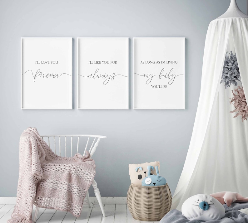 May include: Three white framed prints with black calligraphy text. The first print says "I'll love you forever". The second print says "I'll like you for always". The third print says "As long as I'm living my baby you'll be".