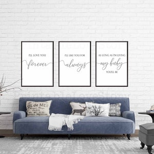 May include: Three black framed prints with white backgrounds and black calligraphy text. The text reads "I'll love you forever", "I'll like you for always", and "As long as I'm living my baby you'll be".