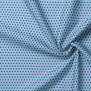 May include: A light blue fabric featuring a repeating pattern of small, dark maroon polka dots. The material is gathered in a soft fold, displaying the consistent texture and the uniform distribution of the circular spots across the surface.
