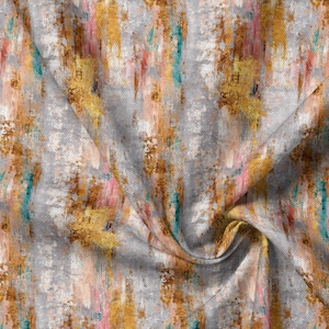 May include: A fabric featuring an abstract pattern with vertical brushstrokes in shades of metallic gold, soft pink, teal, and light gray. The textile has a visible woven texture with folds creating depth and shadows across the surface.