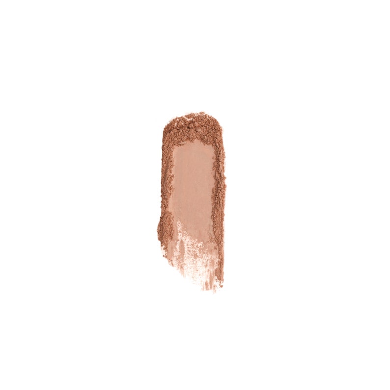 May include: A close-up of a light brown powder makeup swatch. The swatch is a vertical rectangle with a slightly uneven edge.