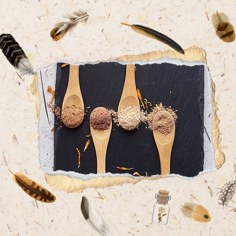 May include: Four wooden spoons filled with different shades of brown powder on a black background. The spoons are arranged in a row, with the powder in each spoon gradually getting darker from left to right.