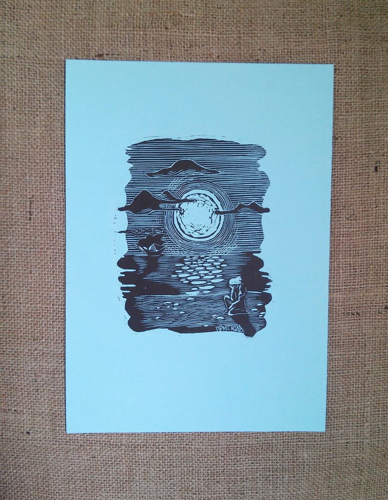 May include: A black and white linocut print on light blue paper. The artwork depicts a moonlit scene with a figure seated near water. The moon is surrounded by clouds, and the water reflects the moonlight. The artist's signature is visible.