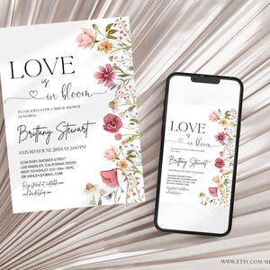 May include: A floral bridal shower invitation with the text "Love is in bloom" and the name "Brittany Stewart". The invitation is decorated with watercolor flowers in shades of pink, red, and yellow.