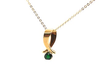 14 karat two-time gold twist pendant on 14 karat yellow gold cable chain