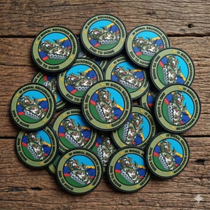 May include: A pile of circular patches with a military theme. Each patch features a tank illustration, the text "IV SIGNAL SQUADRON MECHANIZED", and "2ND TO NONE" in a circular design with blue, green, and yellow accents.