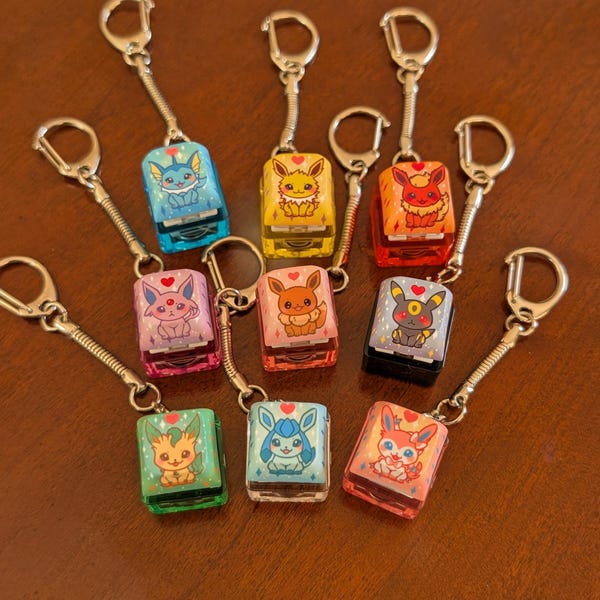 Teclas con forma de criatura adorable: llaveros antiestrés, teclas con forma de Eeveelutions: fuego, agua, eléctrico, normal, psíquico, oscuro, hierba, hielo, hada