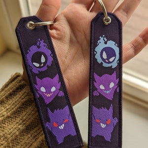 Ghosties Embroidered woven Tag Keychain - Jet tag Keyring Black and Purple w/ Shiny