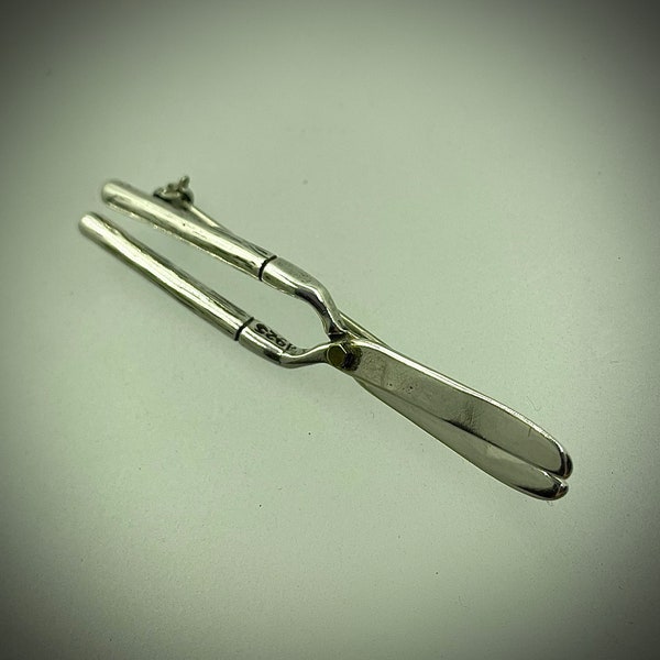 Silver lopers garden tool pin