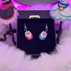 pretty cure magical phone pendant earrings made in metal with pink and blue details