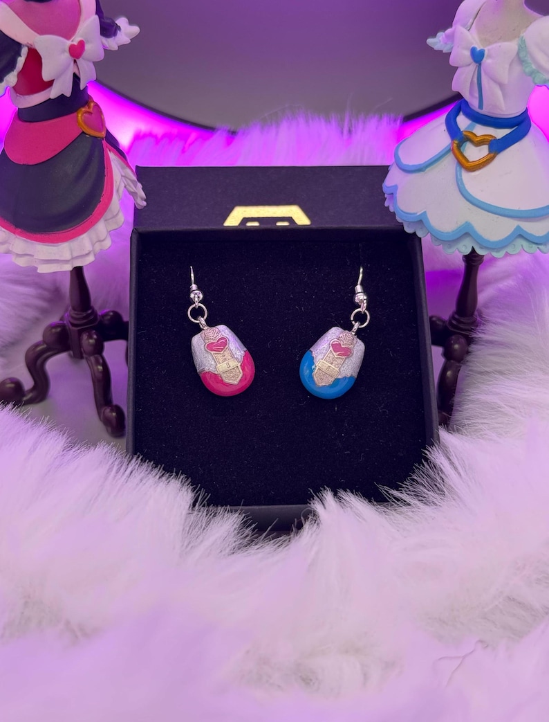 pretty cure magical phone pendant earrings made in metal with pink and blue details