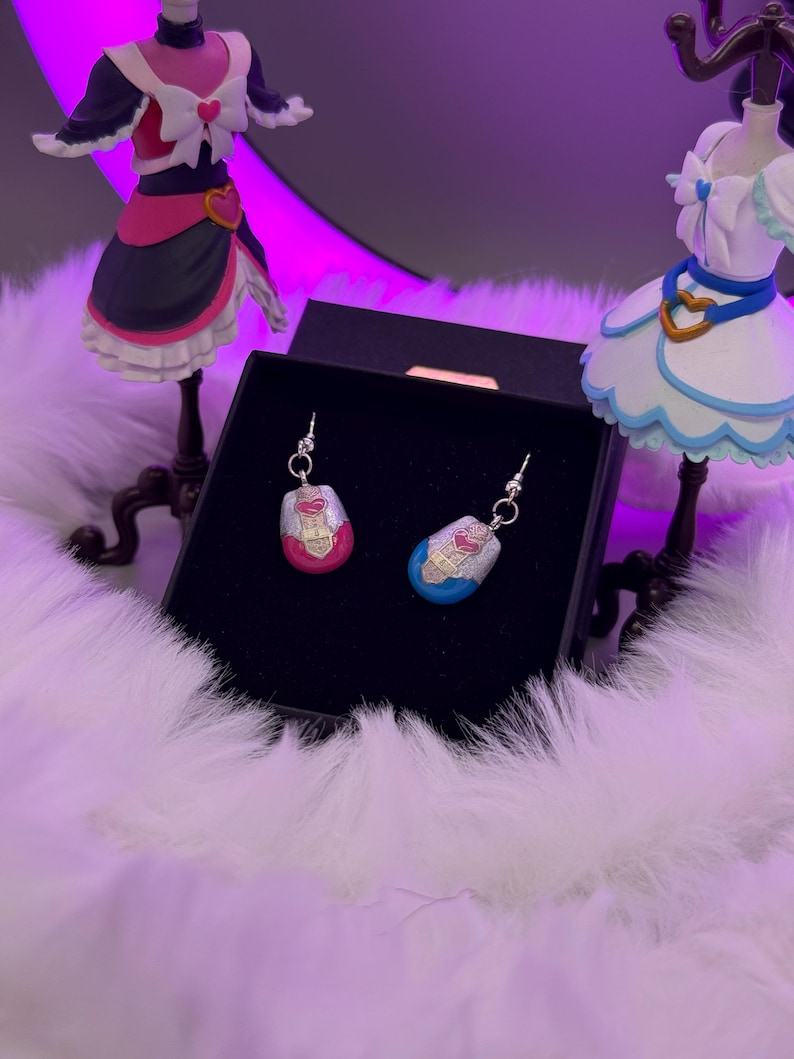 pretty cure magical phone pendant earrings made in metal with pink and blue details