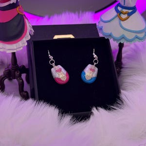 pretty cure magical phone pendant earrings made in metal with pink and blue details