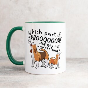 a ceramic mug featuring the phrase 'which part of 'arrooooo!' did you not understand? surrounding an illustration of two beagles howling.