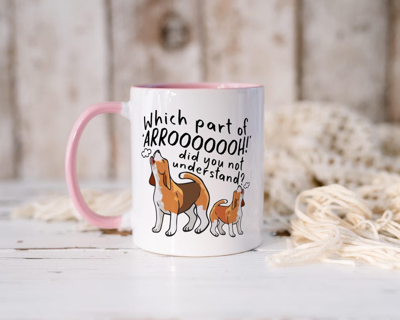 a ceramic mug featuring the phrase 'which part of 'arrooooo!' did you not understand? surrounding an illustration of two beagles howling.