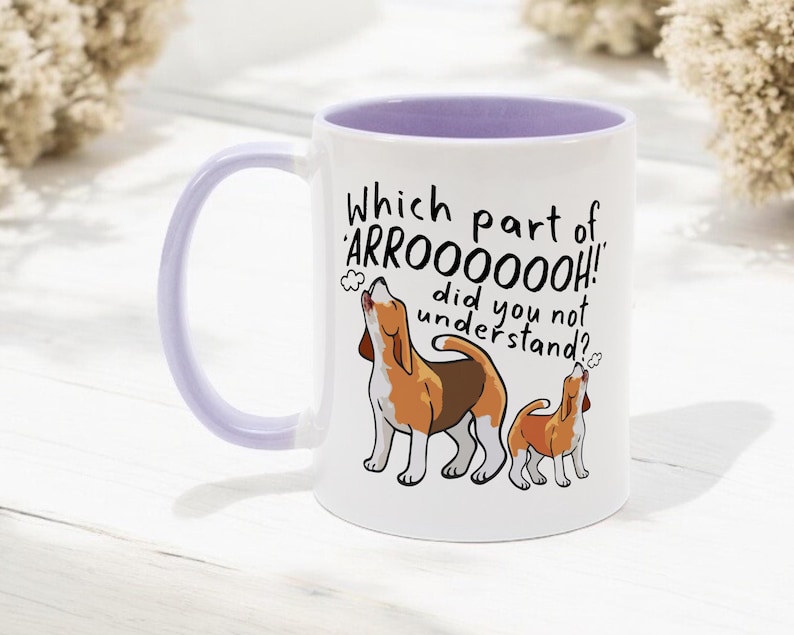 a ceramic mug featuring the phrase 'which part of 'arrooooo!' did you not understand? surrounding an illustration of two beagles howling.