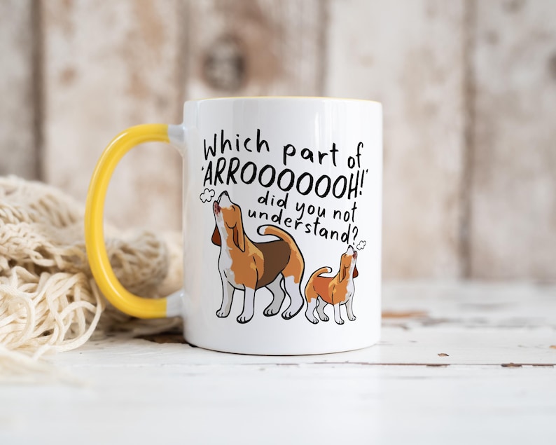 a ceramic mug featuring the phrase 'which part of 'arrooooo!' did you not understand? surrounding an illustration of two beagles howling.
