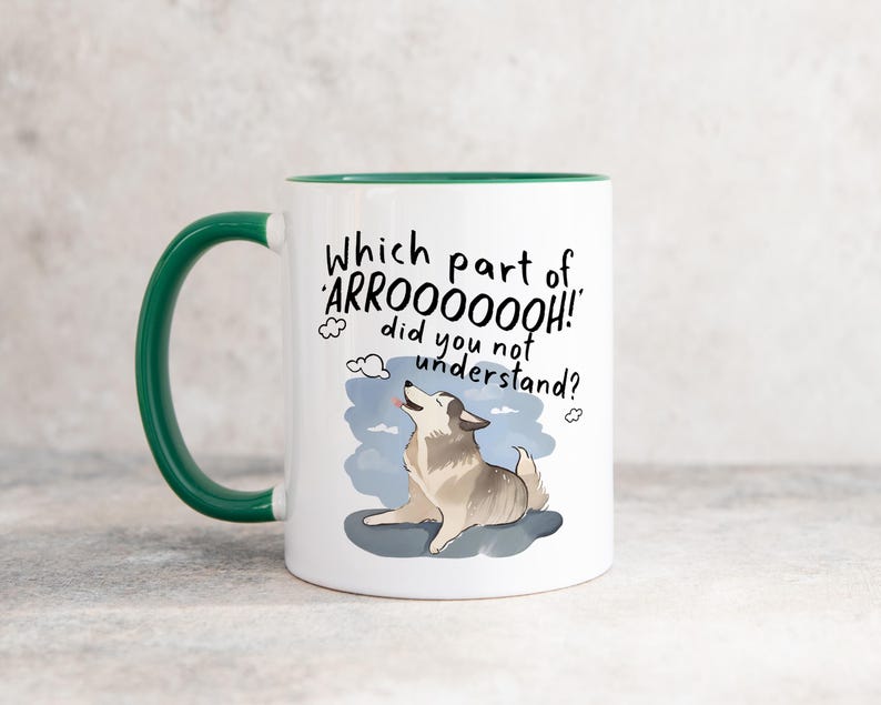 May include: A white ceramic mug with a dark green handle and interior. The front features a graphic of a howling dog with the black text: Which part of ARROOOOOOH! did you not understand? The dog is grey and white, set against a blue sky background.