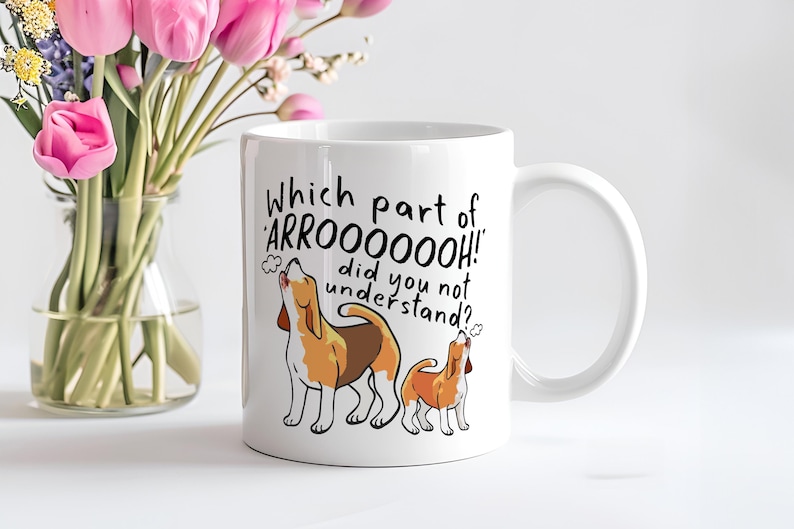 a ceramic mug featuring the phrase 'which part of 'arrooooo!' did you not understand? surrounding an illustration of two beagles howling.