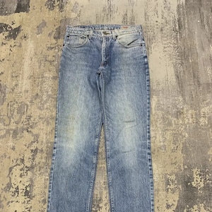 Vintage Wrangler Denim Jeans: Classic Distressed Style in Size 31x31