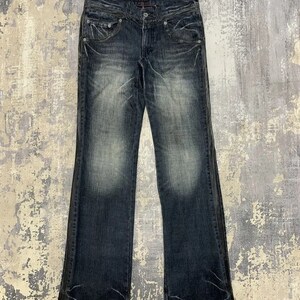 Vintage Y2K Schlagjeans: Gepatchte abgenutzte abgenutzte Bootcut, Taille 32