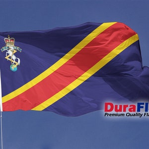 May include: A blue flag with a red and yellow diagonal stripe, featuring a crest with a horse and crown. The flag is on a white pole against a blue sky. The text "DuraFlag" is visible.