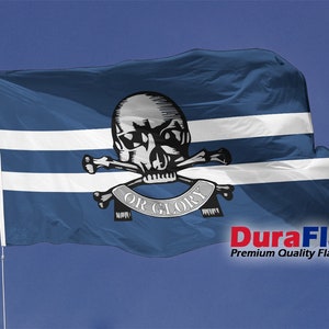 May include: A blue flag featuring two white stripes and a skull and crossbones emblem with the words "OR GLORY". The flag is displayed on a white pole against a blue sky. The text "DuraFlag" is visible.