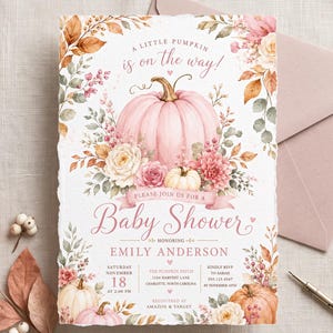 May include: A rectangular baby shower invitation card featuring a large pink pumpkin, floral arrangements, and autumn leaves. The text reads A LITTLE PUMPKIN is on the way! PLEASE JOIN US FOR A Baby Shower HONORING EMILY ANDERSON, with event details.