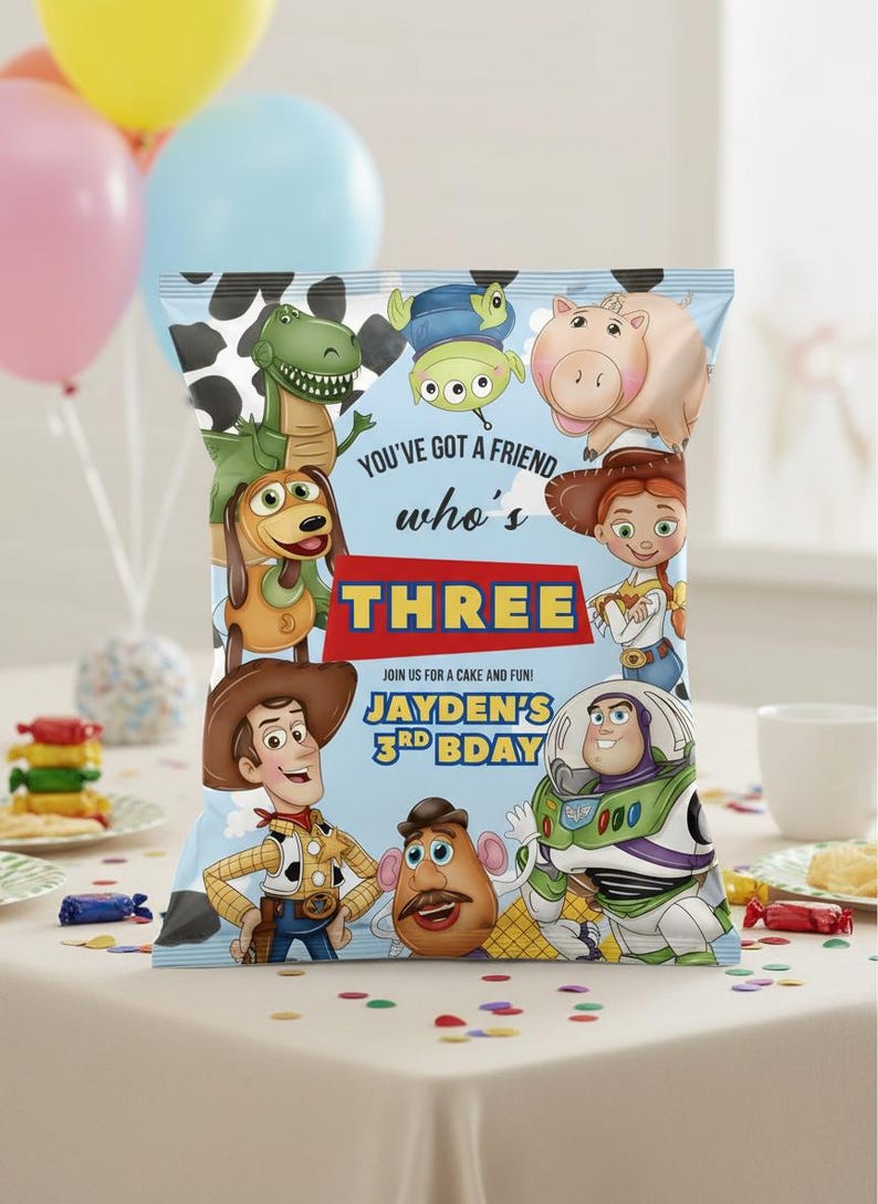 May include: A colorful party favor bag featuring characters from the animated film "Toy Story." The bag has a blue background with the text "You've got a friend who's THREE." The bag is decorated with images of Woody, Buzz Lightyear, and other characters.