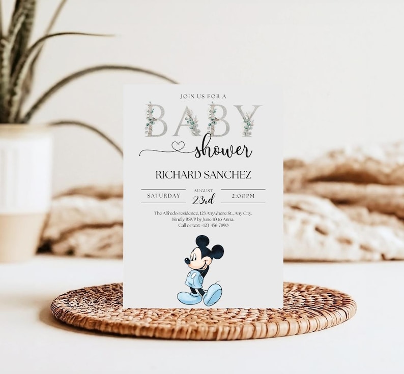 May include: A baby shower invitation featuring the text "BABY shower" with floral accents. The invitation includes the name "RICHARD SANCHEZ", date, time, and a cartoon image of Mickey Mouse in blue. The invitation is on a white background.