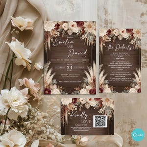May include: A wedding invitation suite featuring a rustic design with a wooden background and floral accents in cream, burgundy, and beige. The suite includes an invitation, details card, and RSVP card. The invitation text reads "Emelia and David" and wedding details.