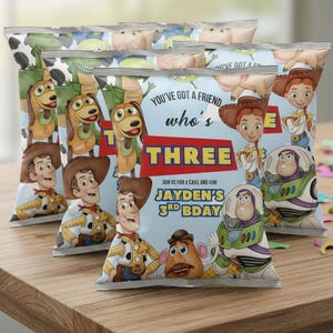 May include: Several snack bags featuring Toy Story characters, including Woody, Buzz Lightyear, and Jessie. The bags have a light blue background with the text "You've got a friend who's THREE" and "Jayden's 3rd Bday".