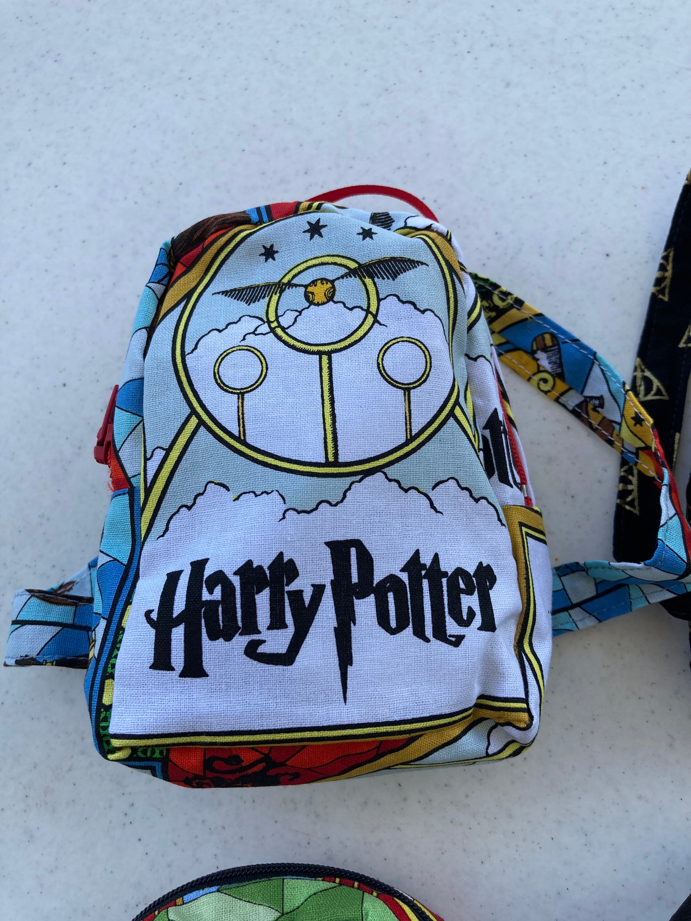 justice mini backpack for dolls REAL LITTLES and printed details Coordinating inside lining This backpack is an officially licensed Laika product. Justice Girls' Pocket Mini Backpack