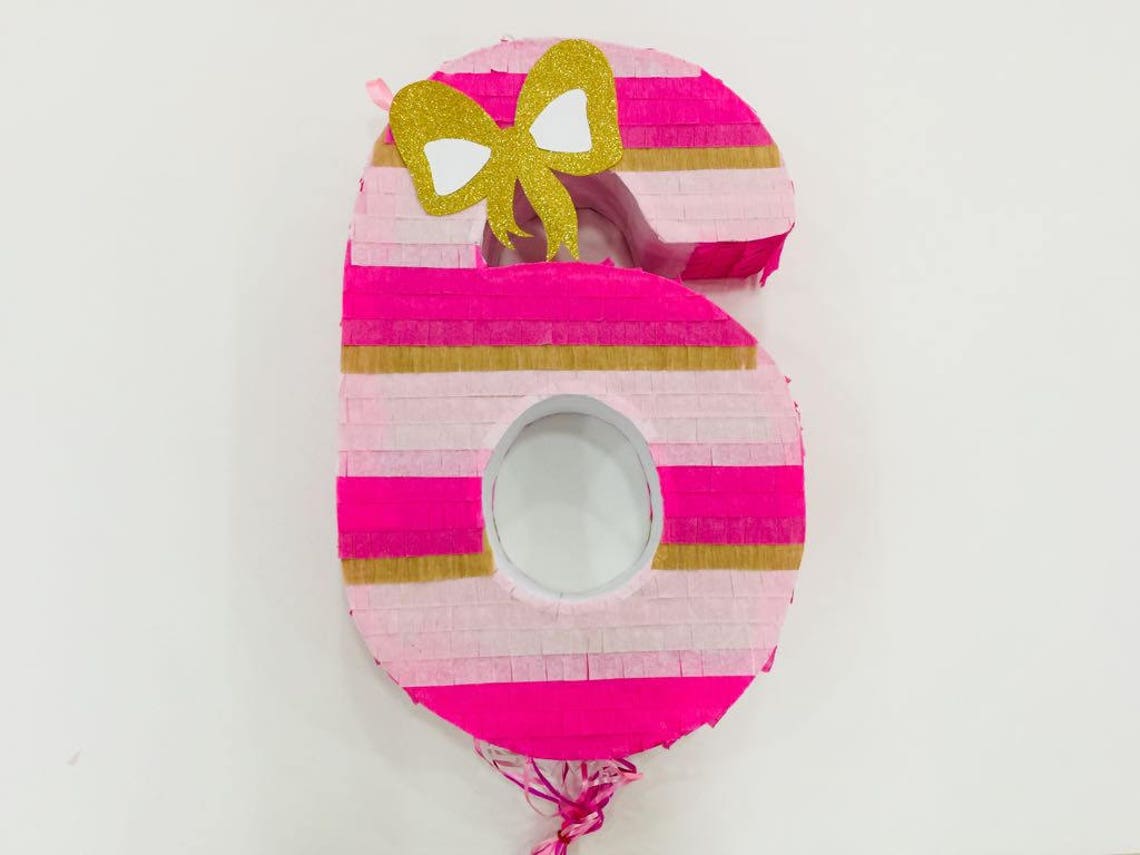 Piñata rosa / lazo dorado - Etsy España