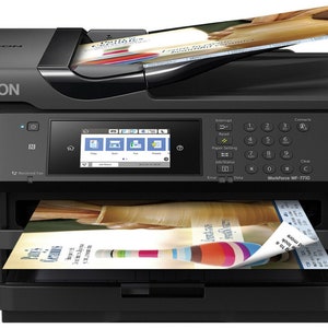 May include: A black Epson WorkForce WF-7710 all-in-one printer with a color touchscreen display and a document feeder. The printer is printing a colorful brochure.