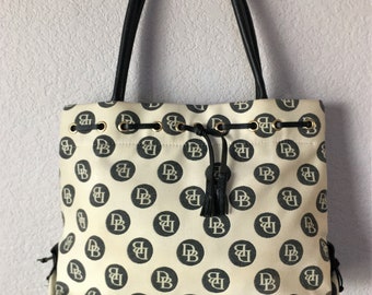 Dooney&Burke  canvas shoulder bag/black leather tassel handle  shoulder bag/black polka dots monogram canvas shoulder bag