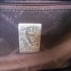 May include: A silver-toned metal tag with a stylized letter "F" and the text "Franco Valente" and "Made in Italy".