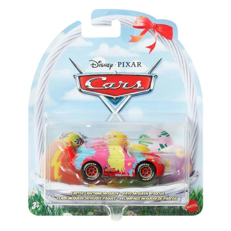 May include: A Disney Pixar Cars Lightning McQueen toy car with an Easter theme. The car is decorated with colorful paint splatters and graphics. The packaging includes the Disney Pixar Cars logo and the text "Easter Lightning McQueen".