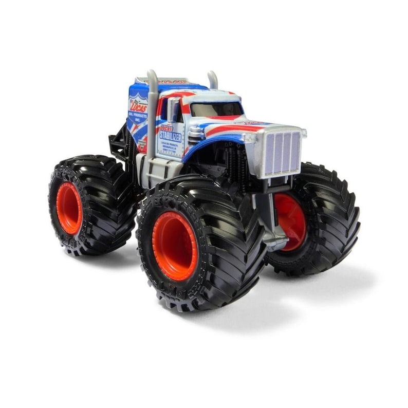 May include: A toy monster truck with large black tires and red rims. The truck's cab is white, blue, and red with the text "Lucas Oil Products" and "Stabilizer". The truck has a silver grill and exhaust pipes.