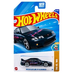 May include: A Hot Wheels die-cast model of a dark blue Nissan Skyline GT-R (BCNR33) car. The car has pink and purple graphics and the text "Seller's". The packaging includes the Hot Wheels logo and the text "70s vs. 90s".