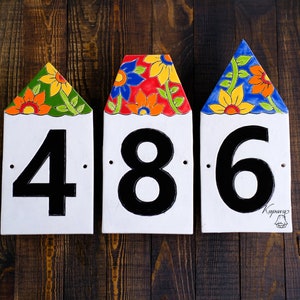 House numbers signs, houses with flower roofs, ceramic number tiles