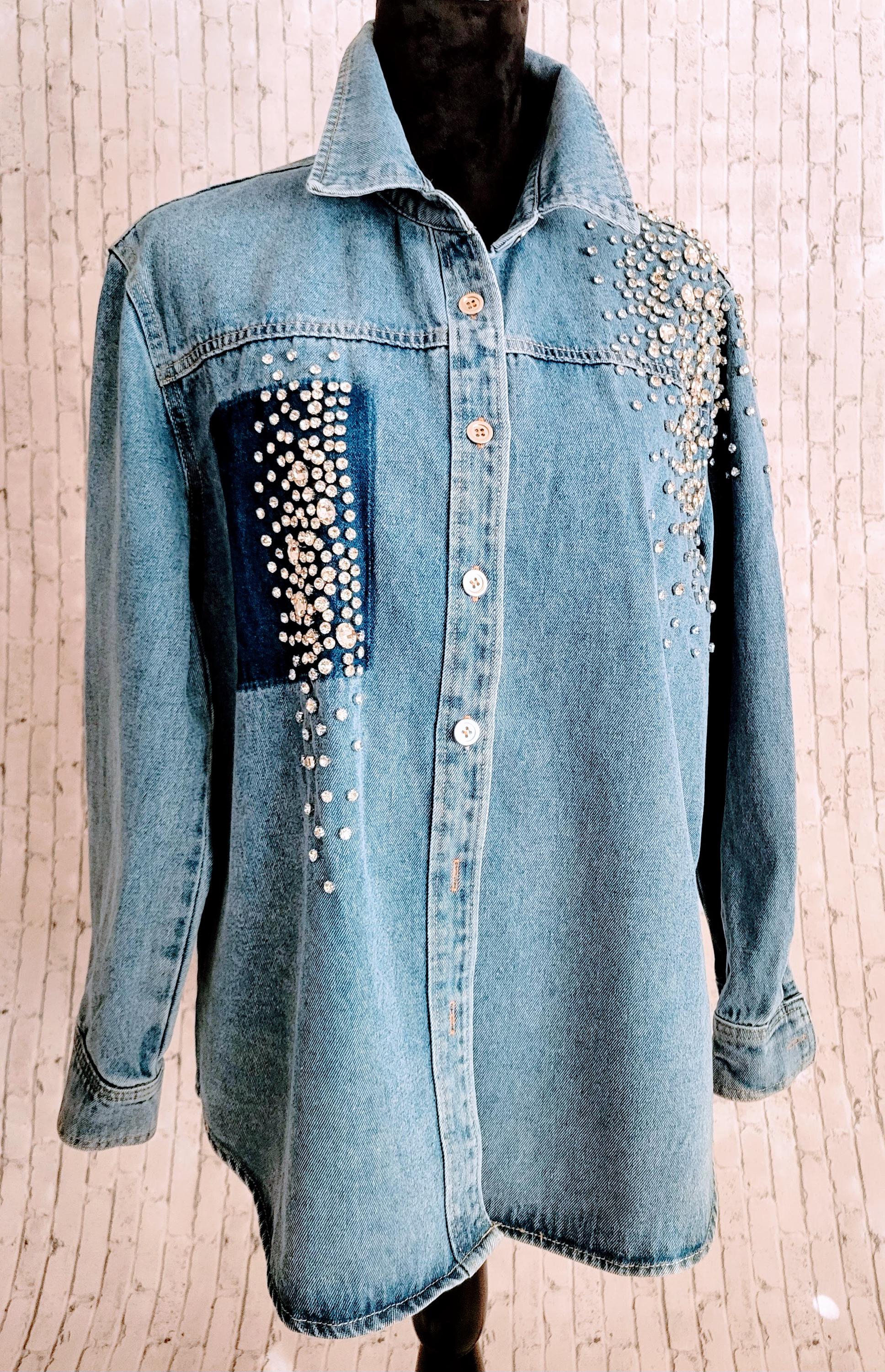 Rhinestone studded jean jacket with rhinestone fringe across the back.