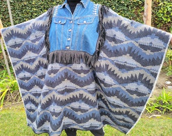 Denim rhinestone studded poncho with Aztec woven fabric body and self fringing edge.