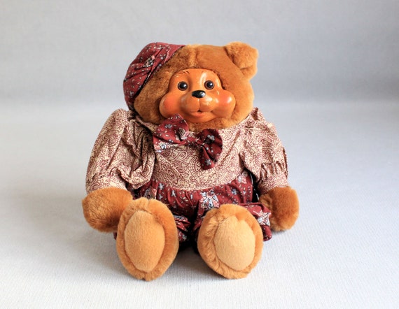 teddy bear with wooden face